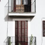 2-storey house with louvered windowpane doors