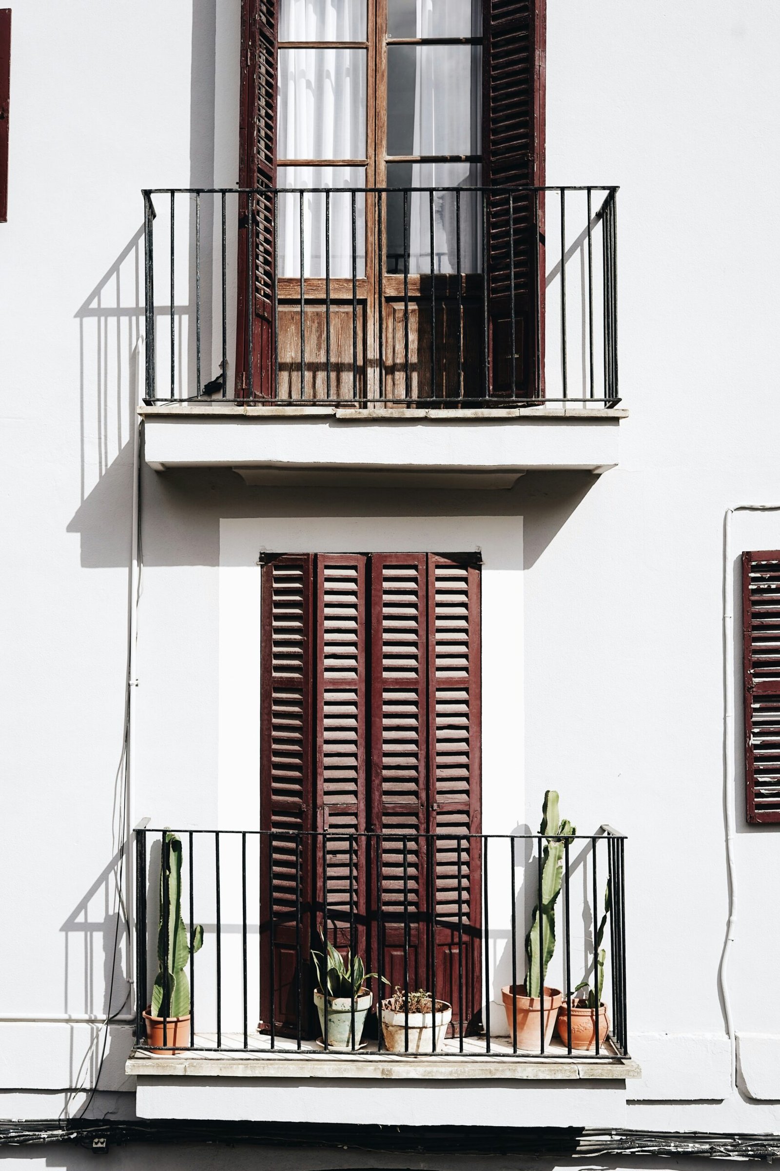 2-storey house with louvered windowpane doors